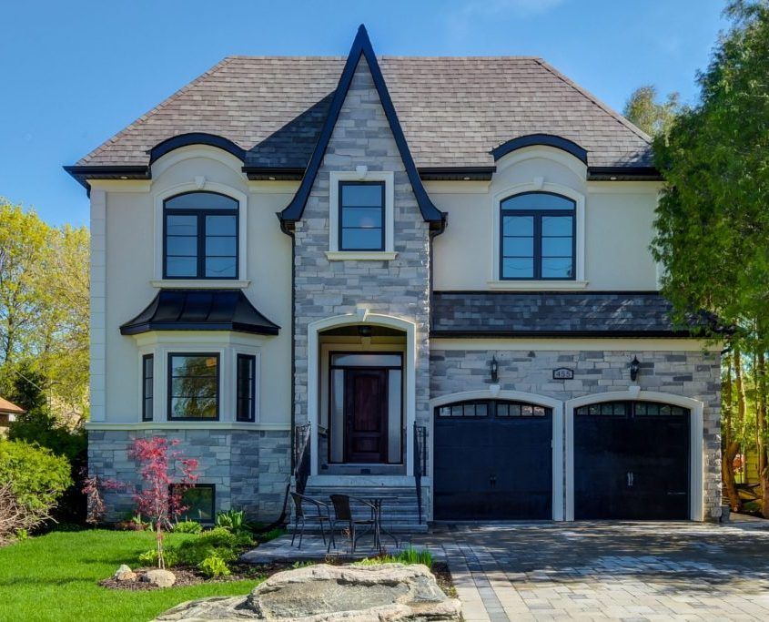 Finished home with a new interlock driveway and landscaping